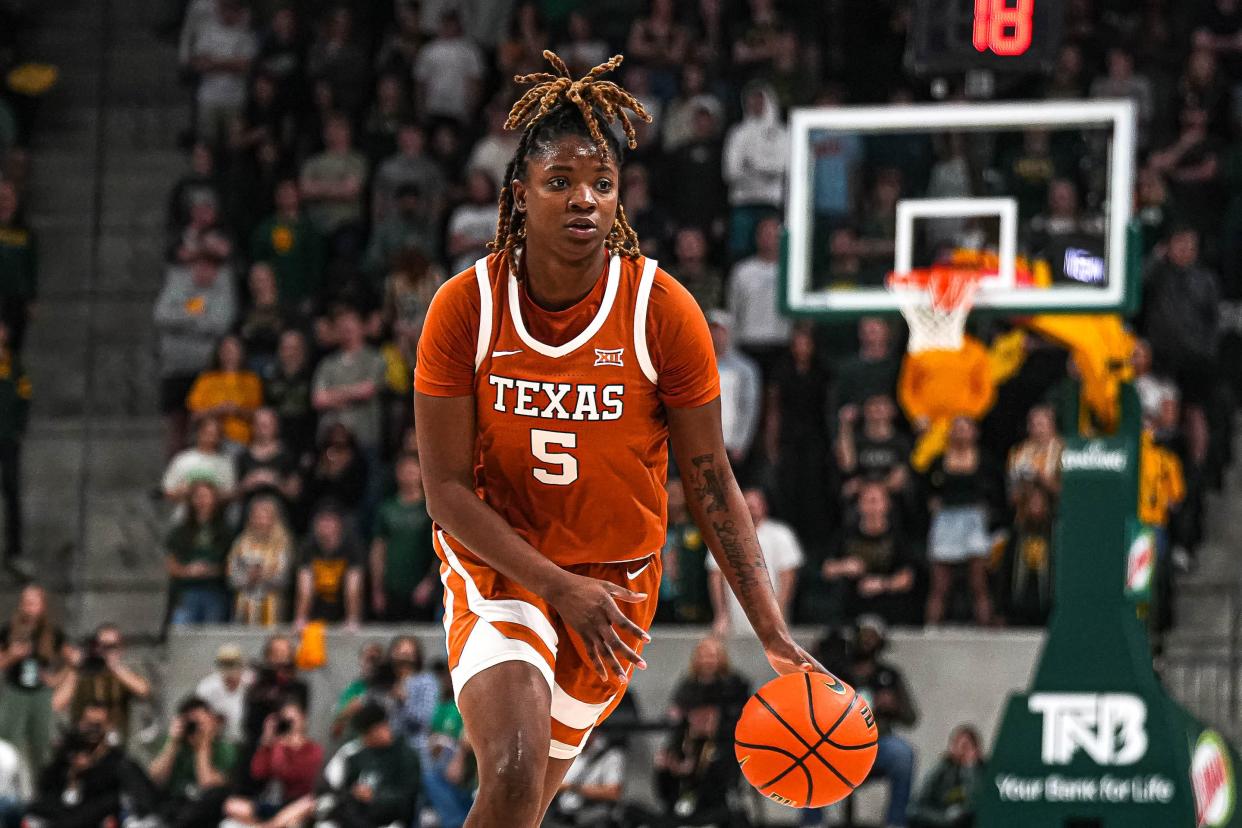 Texas Longhorns forward DeYona Gaston (5) dribbles the ball towards the Baylor basket during the basketball game at the the Foster Pavilion on Thursday, Feb. 1, 2024 in Waco, Texas.