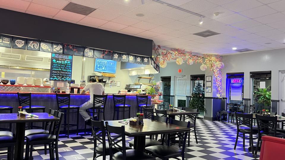 Zakura Sushi & Thai Restaurant in Port St. Lucie is spacious and open with black and white tile floors; simple black tables, chairs and booths; and accents of Japanese cherry blossom vines.