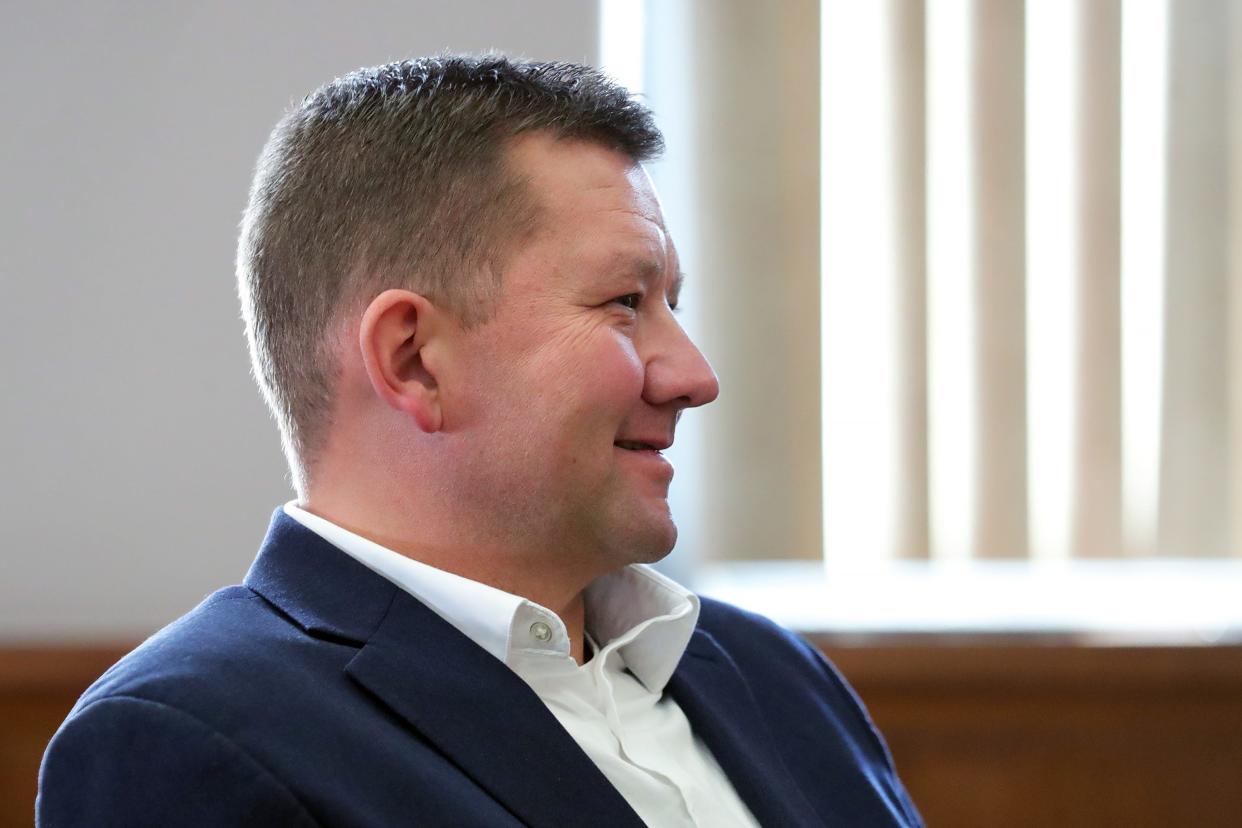 Former state Rep. Bob Young smiles as he agrees to plea guilty to three misdemeanor charges of violating a protection order during a hearing at Barberton Municipal Court Thursday.