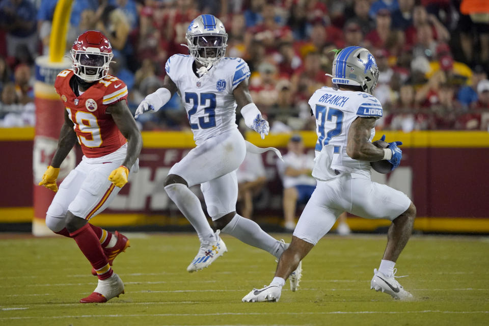 Detroit Lions safety Brian Branch (32) intercepts a pass intended for Kansas City Chiefs wide receiver Kadarius Toney (19) as Lions cornerback Jerry Jacobs (23) watches before running the ball back for a touchdown during the second half of an NFL football game Thursday, Sept. 7, 2023, in Kansas City, Mo. (AP Photo/Ed Zurga)