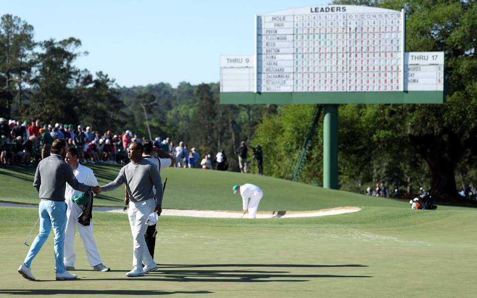 Tiger Woods and Max Homa shake hands after their first rounds