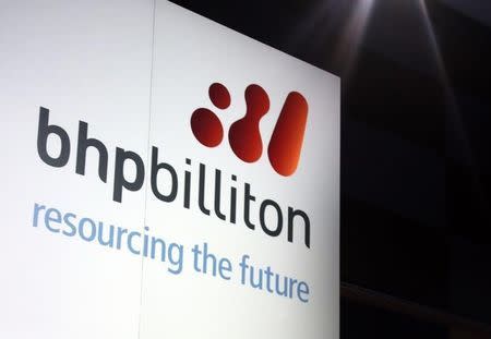 A promotional sign adorns a stage at a BHP Billiton function in central Sydney August 20, 2013. REUTERS/David Gray