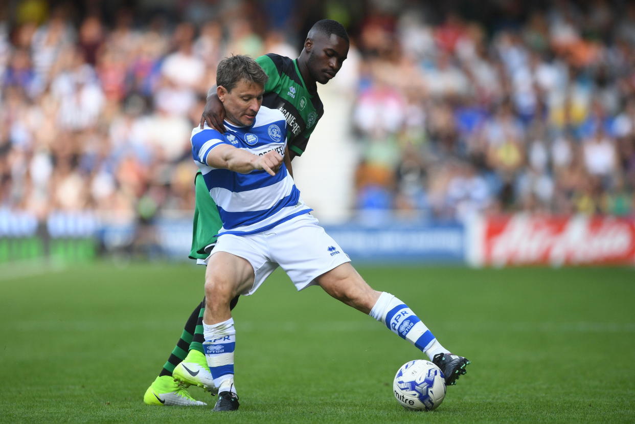 Team Ferdinand's Ben Shephard (front) and Team Shearer's DAVE battle for the ball during Game4Grenfell, a charity football match to raise funds for Grenfell Tower survivors, at QPR's Loftus Road stadium in London. (Photo by Victoria Jones/PA Images via Getty Images)