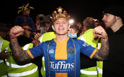 Shrewsbury Town's Jason Cummings at full time as fans invade the pitch - Credit: PA