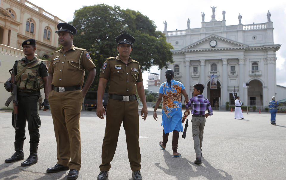 In this Sunday, May 12, 2019, photo, Sri Lankan soldiers stand guard at the entrance to Good Shepherd convent and the St. Benedict's college in Colombo, Sri Lanka. Catholic officials and parents in Sri Lanka are hopeful that church-run schools will begin to reopen soon for the first time since April’s devastating Easter Sunday attacks on churches and hotels. (AP Photo/Eranga Jayawardena)