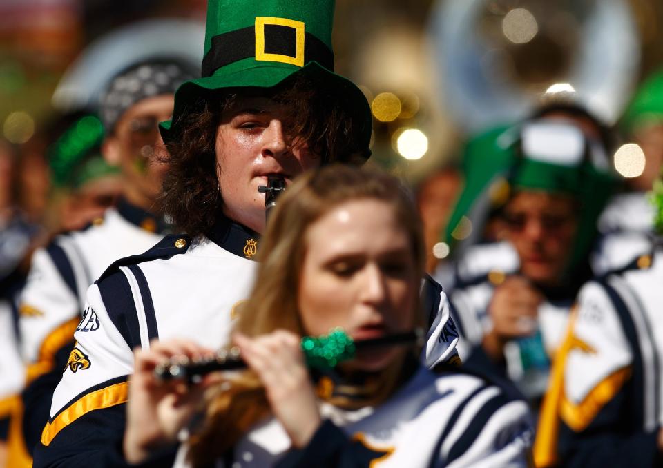 Naples HIgh School Marching Band members perform in the annual St. Patrick's Day parade along Fifth Avenue South on March 17, 2012, in Naples.