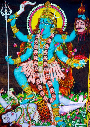 Image of Goddess Kali stepping on her consort Shiva's body as he protects the earth from her wild dance. Photo: Getty