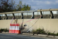 Damage to road barriers on the A40 near Oxford where a four-year-old girl, a six-year-old boy, an eight-year-old girl and a 29-year-old woman from Chinnor, Oxfordshire, died Monday night after a collision between a people carrier and a heavy goods vehicle.