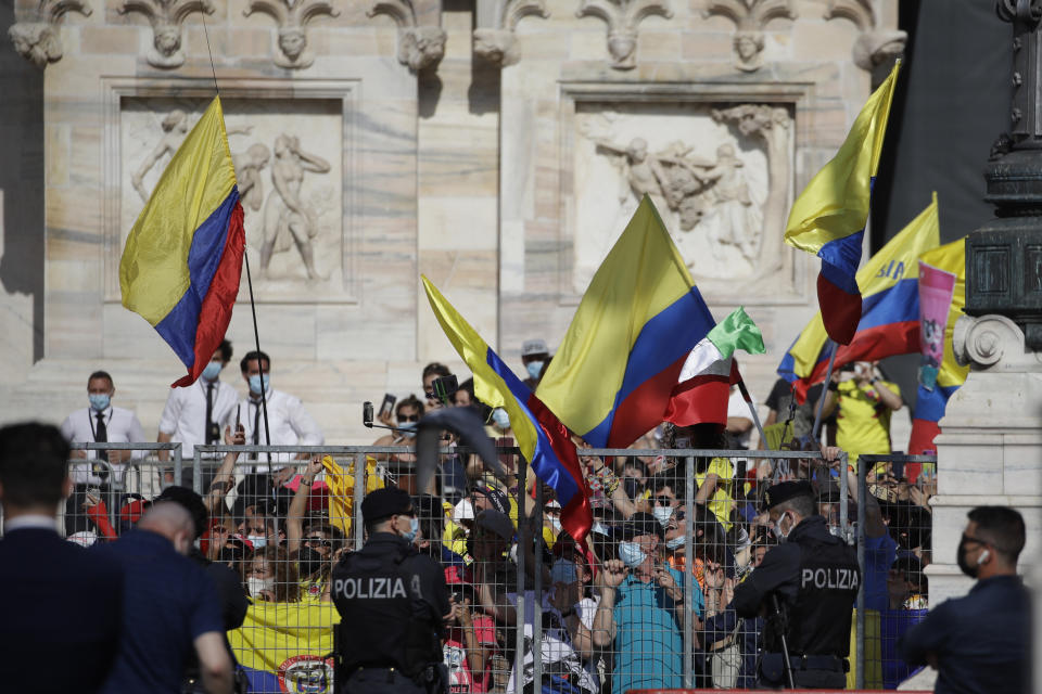 Colombian fans celebrate as Egan Bernal completes the final stage to win the Giro d'Italia cycling race, a 30.3 kilometers individual time trial from Senago to Milan, Italy, Sunday, May 30, 2021. (AP Photo/Luca Bruno)