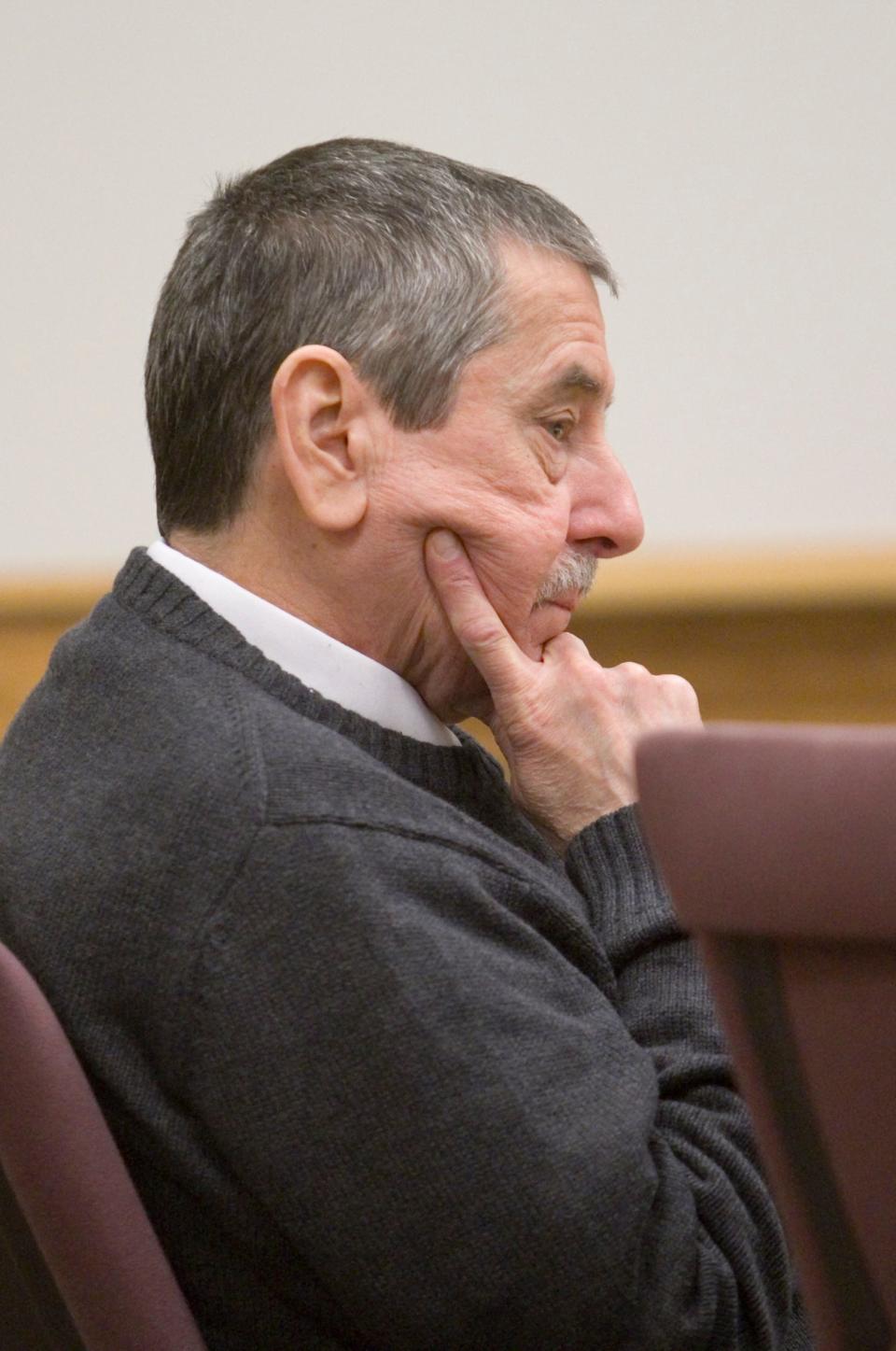 Jerome Kowalski listens Monday, Jan. 7, 2013, during the first day of his trial for the murder of his brother and sister-in-law.