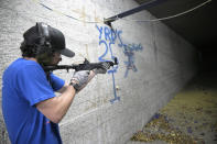 KelTec employee Bobby Cormier tests a 9mm SUB2000 rifle, similar to ones being shipped to Ukraine, at their manufacturing facility on Thursday, March 17, 2022, in Cocoa, Fla. The Florida-based company decided to donate weapons to Ukraine's nascent resistance movement after it could no longer locate a longtime civilian customer in Odessa that had ordered $200,000 worth of rifles before Vladimire Putin's invasion. (AP Photo/Phelan M. Ebenhack)