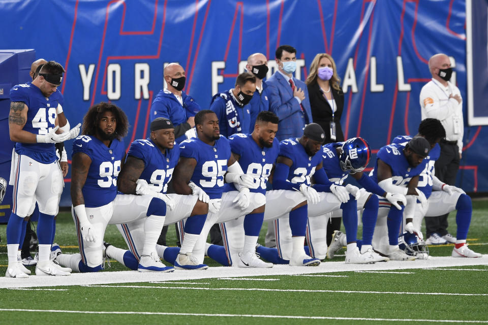 Members of the New York Giants kneel before a game. (Photo by Sarah Stier/Getty Images)