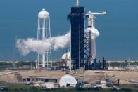 A SpaceX Falcon 9 rocket purges fuel after topping off before scheduled launch in Cape Canaveral