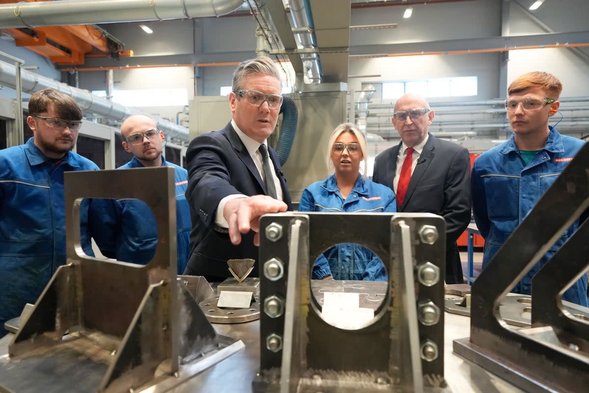 Sir Keir Starmer talking to workers during a visit to BAE Systems in Barrow-in-Furness, Cumbria where Britain is building its next generation of nuclear submarines (Danny Lawson/PA Wire)