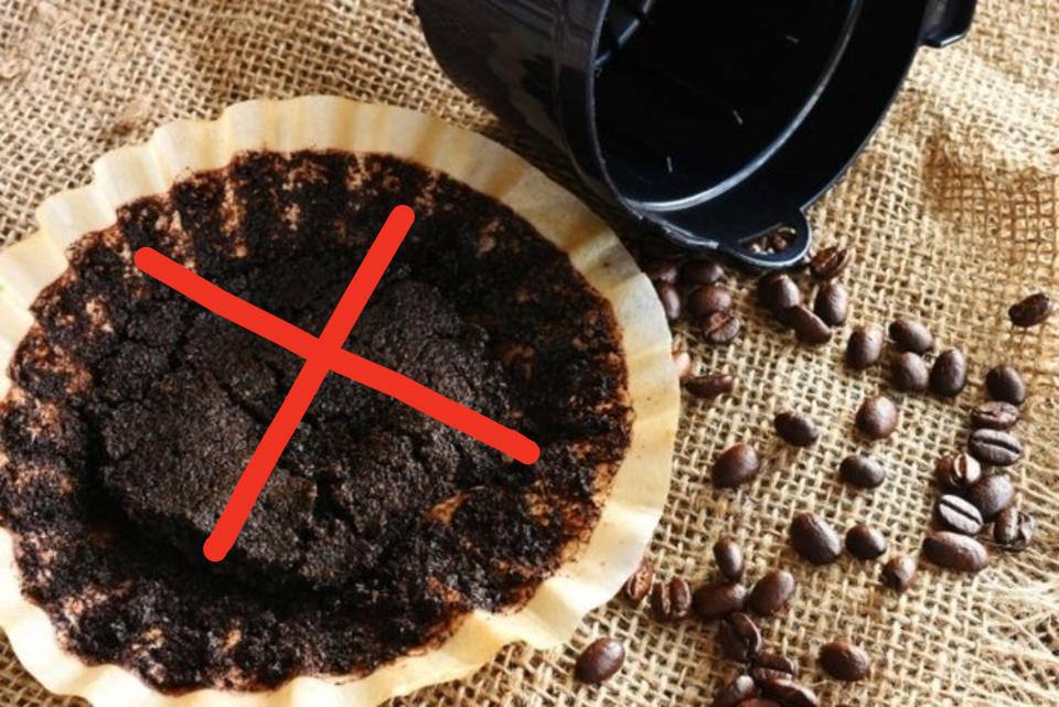 Coffee grounds in a coffee filter with an "X" through it