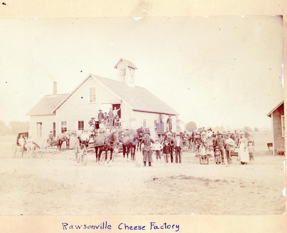 A crowd gathers for a photo outside of the Rawsonville Cheese Factory in the 1930s.