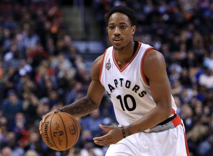 TORONTO, ON - APRIL 12:  DeMar DeRozan #10 of the Toronto Raptors dribbles the ball during the second half of an NBA game against the Philadelphia 76ers at the Air Canada Centre on April 12, 2016 in Toronto, Ontario, Canada.  NOTE TO USER: User expressly acknowledges and agrees that, by downloading and or using this photograph, User is consenting to the terms and conditions of the Getty Images License Agreement.  (Photo by Vaughn Ridley/Getty Images)