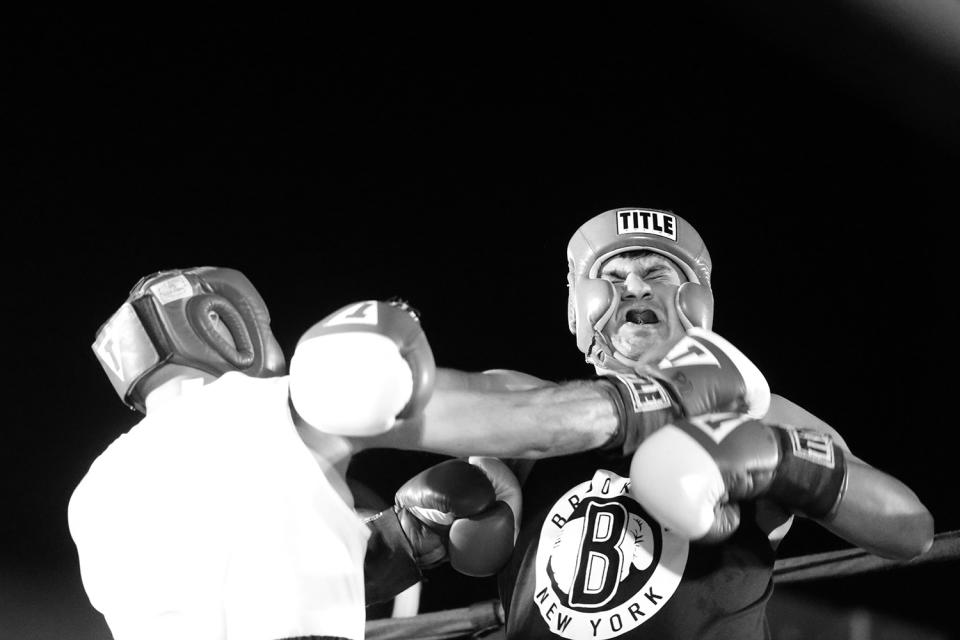 <p>Anthony Mangano lands a right to the chin of Rich Altamirano during a grudge match at the Brooklyn Smoker in the parking lot of Gargiulo’s Italian restaurant in Coney Island, Brooklyn, on Aug. 24, 2017. Mangano won the bout unanimously. (Photo: Gordon Donovan/Yahoo News) </p>