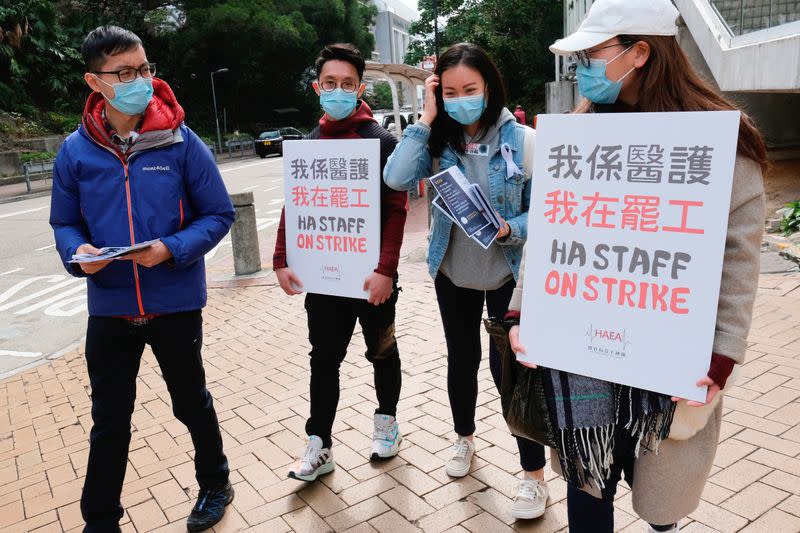 Medical workers hold a strike near Queen Elizabeth Hospital as they demand Hong Kong close its border with China to reduce the coronavirus spreading, in Hong Kong