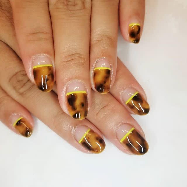 <p>Since the classic tortoiseshell pattern borrows from autumn's color palette, this pretty design is still on-point. Take the design only halfway down your nail, and finish it with a brighter, painted-on band. </p><p><a href="https://www.instagram.com/p/BvAiScJg3xt/" rel="nofollow noopener" target="_blank" data-ylk="slk:See the original post on Instagram;elm:context_link;itc:0;sec:content-canvas" class="link ">See the original post on Instagram</a></p>