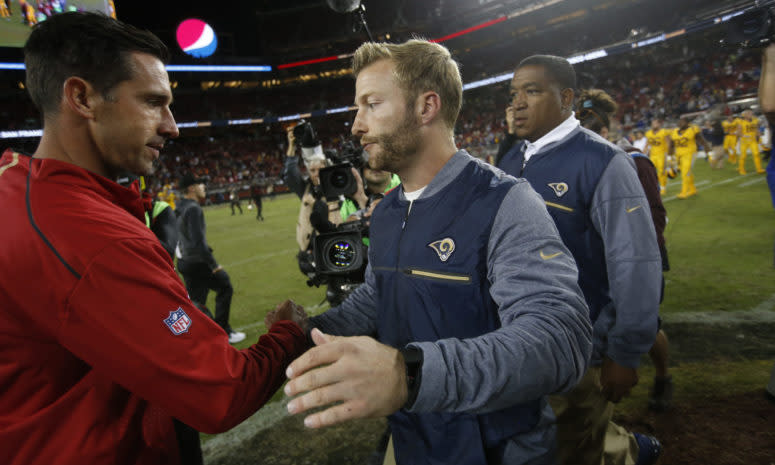 San Francisco 49ers head coach Kyle Shanahan speaks with Rams head coach Sean McVay at a game.