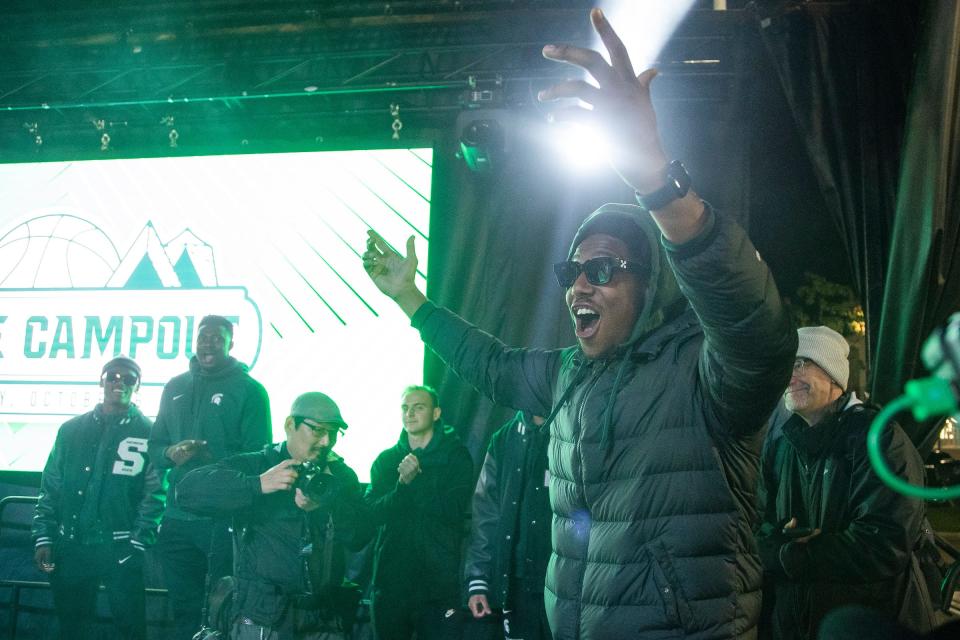 MSU basketball player A.J. Hoggard waves at fans when he is being introduced during Izzone Campout at Munn Field near Breslin Center in East Lansing on Friday, Oct. 6, 2023.