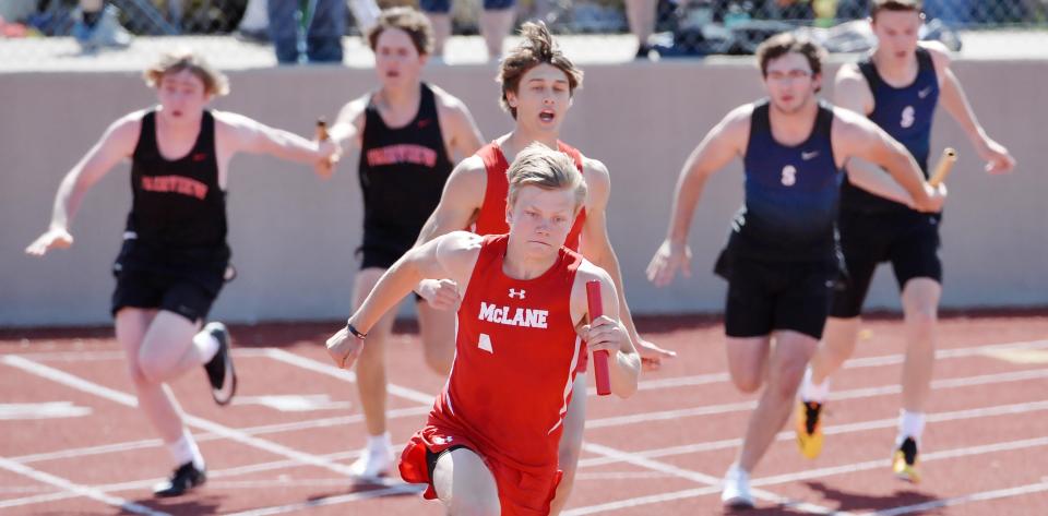 Runners compete in the boys 400-meter relay during the Erie County Classic Track & Field meet.