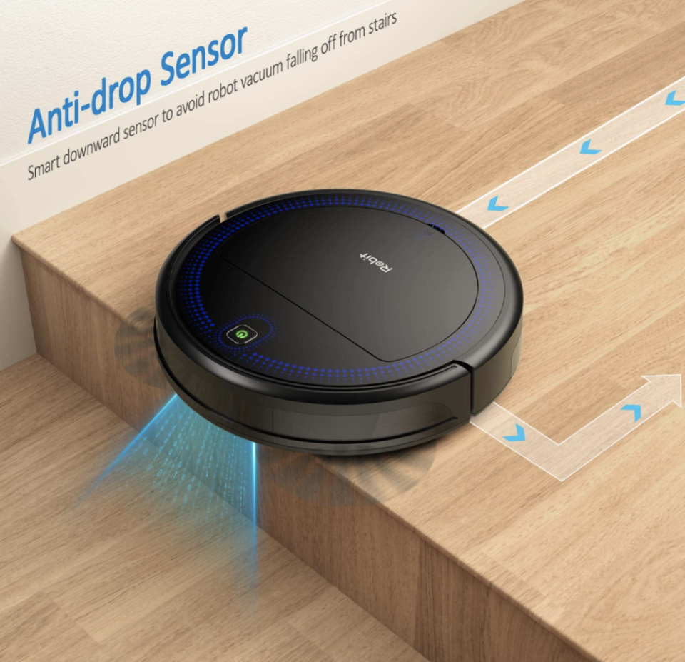 Robit V7S PRO Robot Vacuum Cleaner on wooden stairs