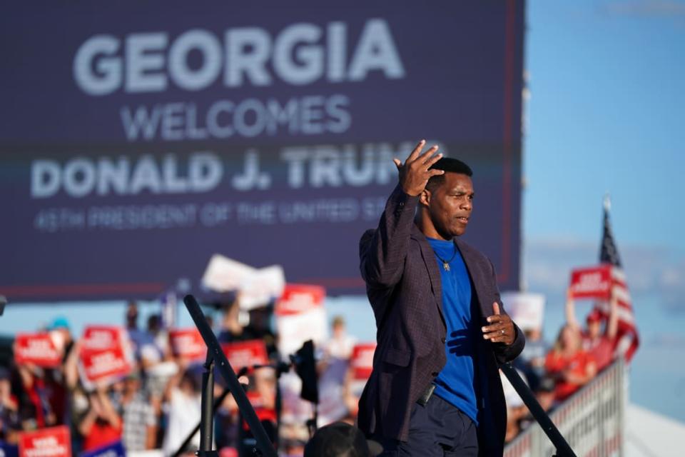 <div class="inline-image__caption"><p>Herschel Walker walks off the stage during a rally featuring former US President Donald Trump on September 25, 2021 in Perry, Georgia. </p></div> <div class="inline-image__credit">Sean Rayford/Getty</div>