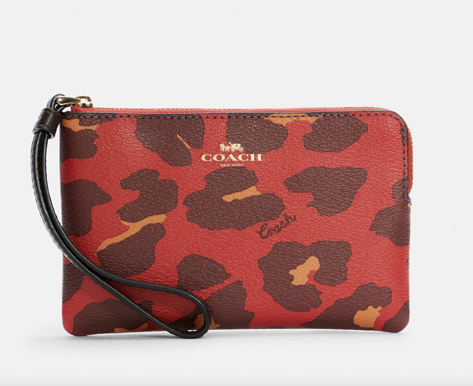 Corner Zip Wristlet With Leopard Print in red brown and orange (Photo via Coach Outlet)