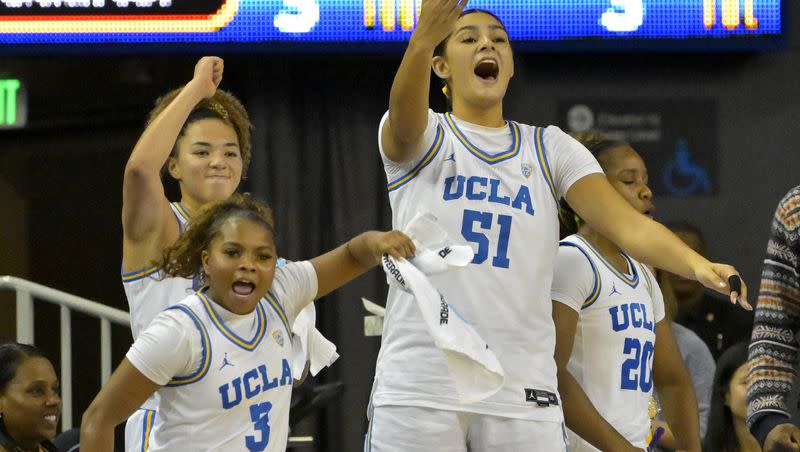 FILE — UCLA guard Londynn Jones (3), guard Kiki Rice, center Lauren Betts (51) and guard Charisma Osborne celebrate on the bench during an NCAA college basketball game against Hawaii Thursday, Dec. 21, 2023, in Los Angeles. Jones scored a career-high 23 points and Betts added 14 in a win over Utah on Thursday.