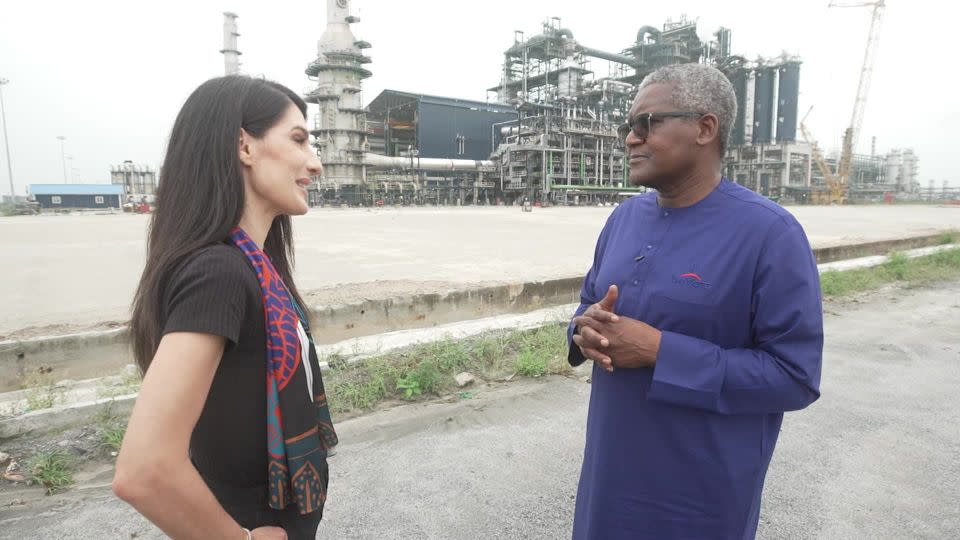 Aliko Dangote walks CNN's Eleni Giokos through his oil refinery in Lekki, Nigeria. - CNN