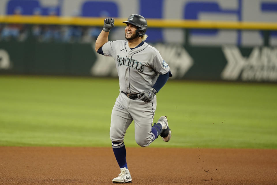 Seattle Mariners' Eugenio Suarez runs the bases after hitting a solo home run during the fourth inning of a baseball game against the Texas Rangers in Arlington, Texas, Sunday, June 5, 2022. (AP Photo/LM Otero)