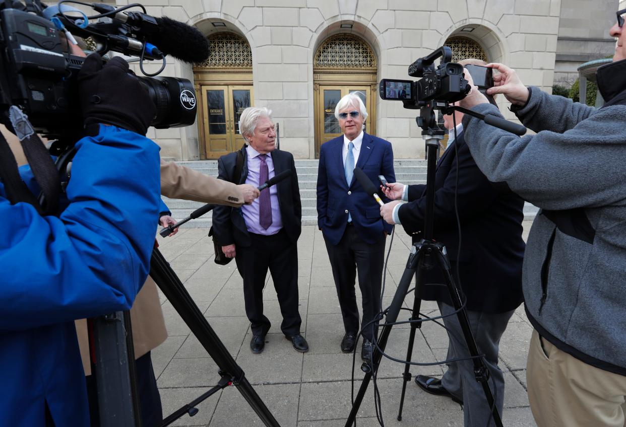 Hall of Fame trainer Bob Baffert, right, spoke to the media outside U.S. District Court in Louisville, Ky. on Feb. 2, 2023 along with his attorney Clark Brewster after a hearing to seek a temporary injunction to lift his ban from Churchill Downs so he can participate in this year's Kentucky Derby.  The hearing was extended another day.