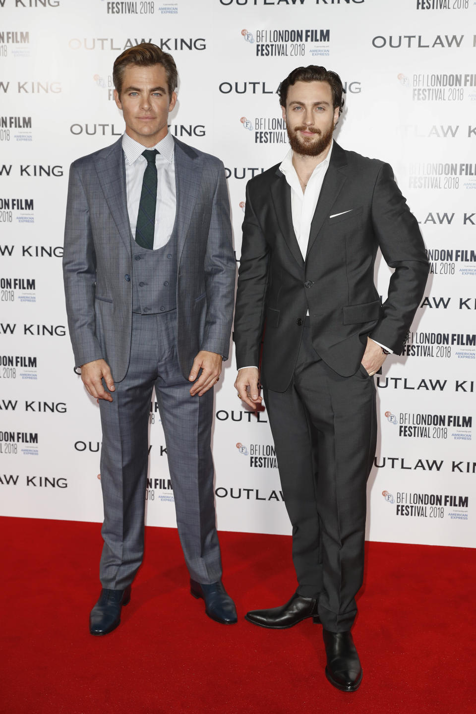 <p>Chris, clad in a green, skinny tie and tails and Aaron, sans tie but looked sharp nonetheless, took to the red carpet at the BFI London Film Festival. <em>[Photo: Getty]</em> </p>