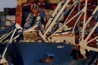 Wreckage of the Francis Scott Key Bridge rests on the container ship Dali, Saturday, March 30, 2024, in Baltimore. (AP Photo/Julia Nikhinson)
