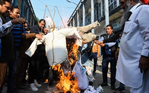 Activists burn effigies of rapists in Amritsar - Credit: NARINDER NANU/AFP via Getty Images