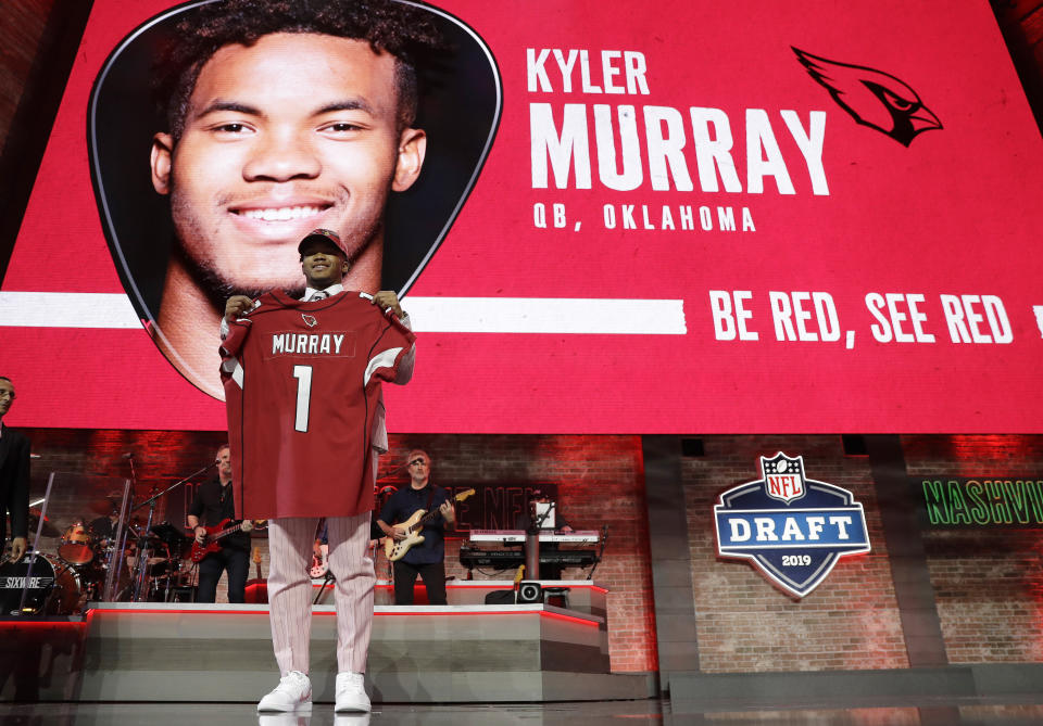 Oklahoma quarterback Kyler Murray shows off his new jersey after the Arizona Cardinals selected Murray in the first round at the NFL football draft, Thursday, April 25, 2019, in Nashville, Tenn. (AP Photo/Mark Humphrey)