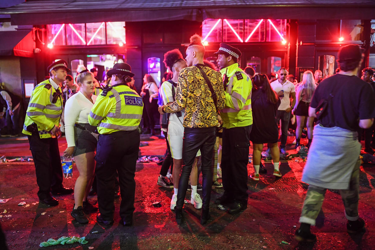 LONDON, ENGLAND - JULY 04: Police officers are seen breaking up a fight outside a pub in Soho on July 4, 2020 in London, United Kingdom. The UK Government announced that Pubs, Hotels and Restaurants can open from Saturday, July 4th providing they follow guidelines on social distancing and sanitising. (Photo by Peter Summers/Getty Images)