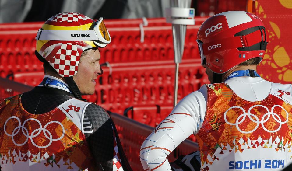 United States' Bode Miller, right, chats with Croatia's Ivica Kostelic after completing men's downhill combined training at the Sochi 2014 Winter Olympics, Thursday, Feb. 13, 2014, in Krasnaya Polyana, Russia. (AP Photo/Christophe Ena)