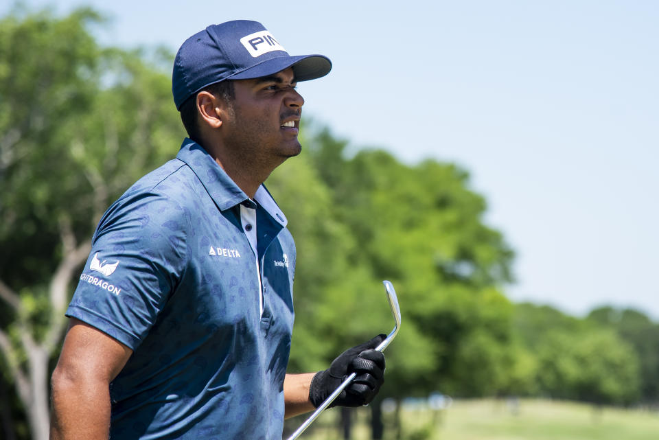 Sebastián Muñoz, of Colombia, reacts after his shot lands near the 18th hole during the first round of the AT&T Byron Nelson golf tournament in McKinney, Texas, on Thursday, May 12, 2022. (AP Photo/Emil Lippe)