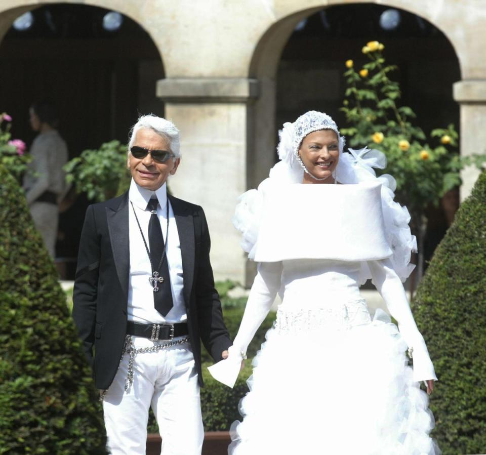 Designer Karl Lagerfeld walks with former top model Linda Evangelista after the show for Chanel 08 July 2003 during the autumn-winter 2003/04 haute couture collections in Paris. (AFP/Getty Images)