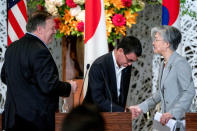 U.S. Secretary of State Mike Pompeo, Japan's Foreign Minister Taro Kono and South Korea's Foreign Minister Kang Kyung Wha speak with each other after a news conference in Tokyo, Japan, July 8, 2018. Andrew Harnik/Pool via Reuters