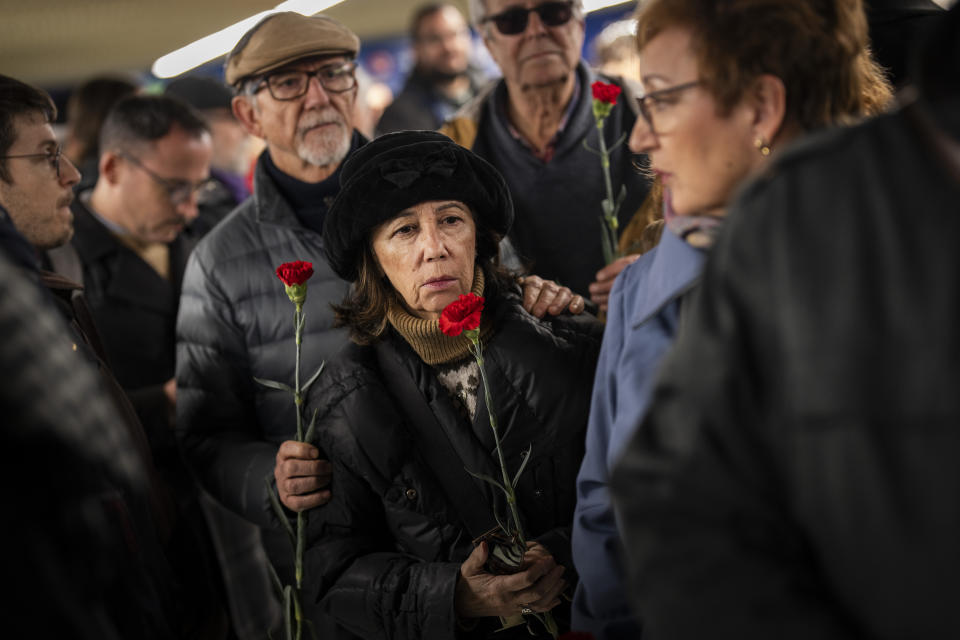 People queue to lay flowers at a memorial for the 2004 train bombing victims inside Atocha train station in Madrid, Spain, Monday, March 11, 2024. Victims of terror attacks are a symbol of the constant need to guard freedom and the rule of law against threats, Spain’s King Felipe VI said Monday at a ceremony marking the 20th anniversary of Europe’s deadliest terror attack. March 11 was chosen as a day of continent-wide commemoration of terrorism victims after the train bombing in the Spanish capital on March 11, 2004 that killed nearly 200 people. (AP Photo/Bernat Armangue)