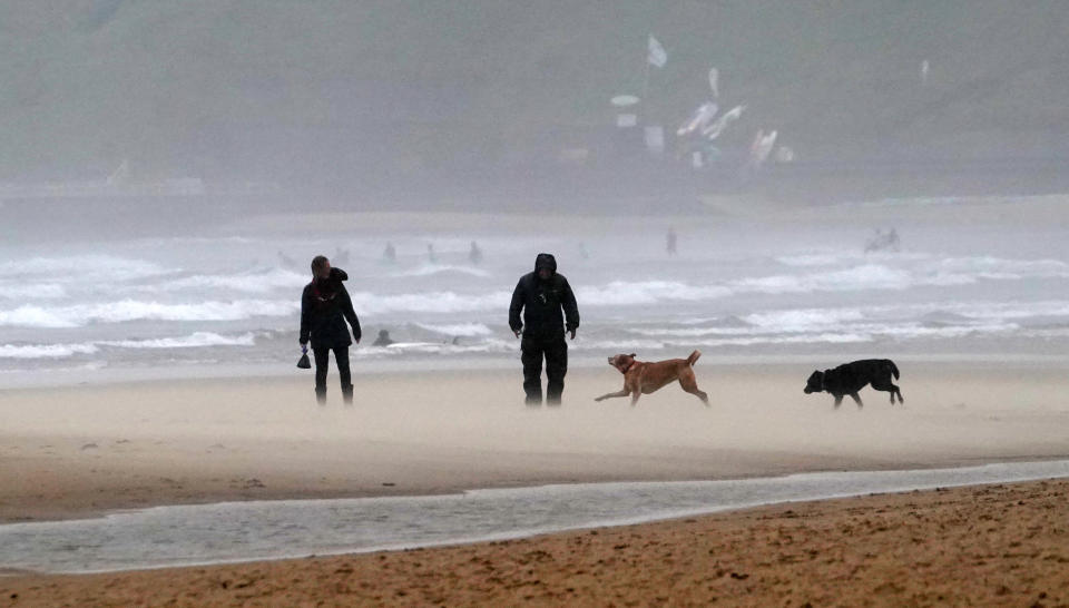 Walkers on a windy Tynemouth beach as Storm Francis has brought gusts of more than 50mph overnight ahead of the wet and windy weather impacting vast swathes of the UK and Ireland.