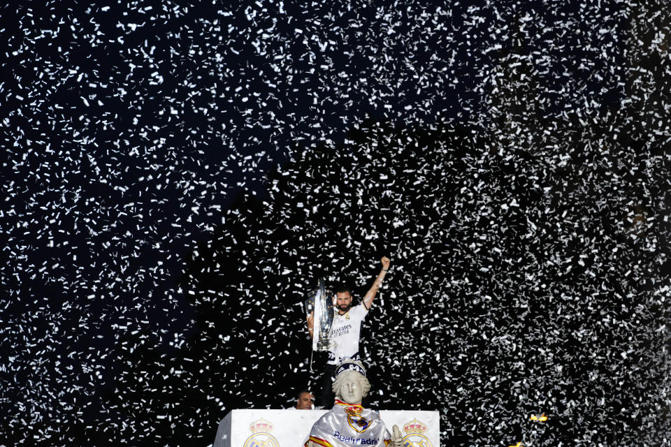 Real Madrid's Nacho holds the Champions League trophy at the Cibeles square during a trophy parade in Madrid, Spain, Sunday, June 2, 2024. Real Madrid won against Borussia Dortmund 2-0. (AP Photo/Bernat Armangue)