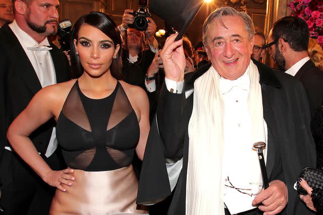 <p>Gisela Schober/Getty</p> Kim Kardashian and Richard Lugner attend the Vienna Opera Ball in 2014.