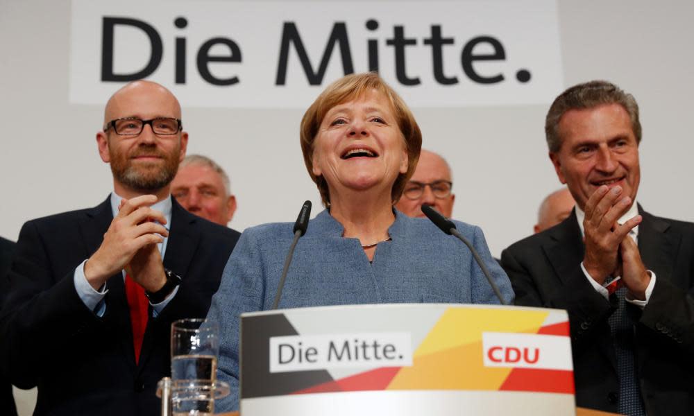 Angela Merkel addresses supporters after exit polls showed the chancellor’s CDU party heading for a comfortable victory in the German elections.