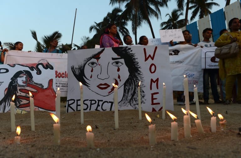 Members of 'Aastha' campaign group stage a protest in Mumbai on Thursday. An Indian gang-rape victim is "struggling against the odds" to survive on Friday after suffering a heart attack and brain injuries, as medics criticised a decision to fly her to Singapore