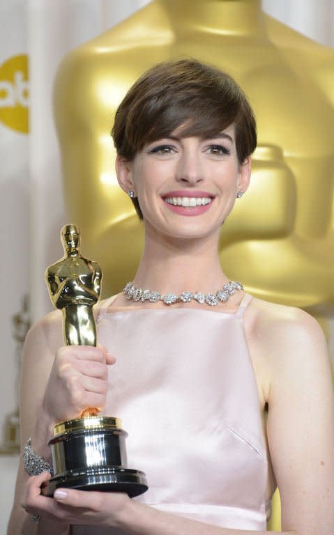 Anne Hathaway celebrates winning Best Performance by an Actress in a Supporting Role for "Les Mserables" in the press room during the Oscars on February 24, 2013 in Hollywood, California